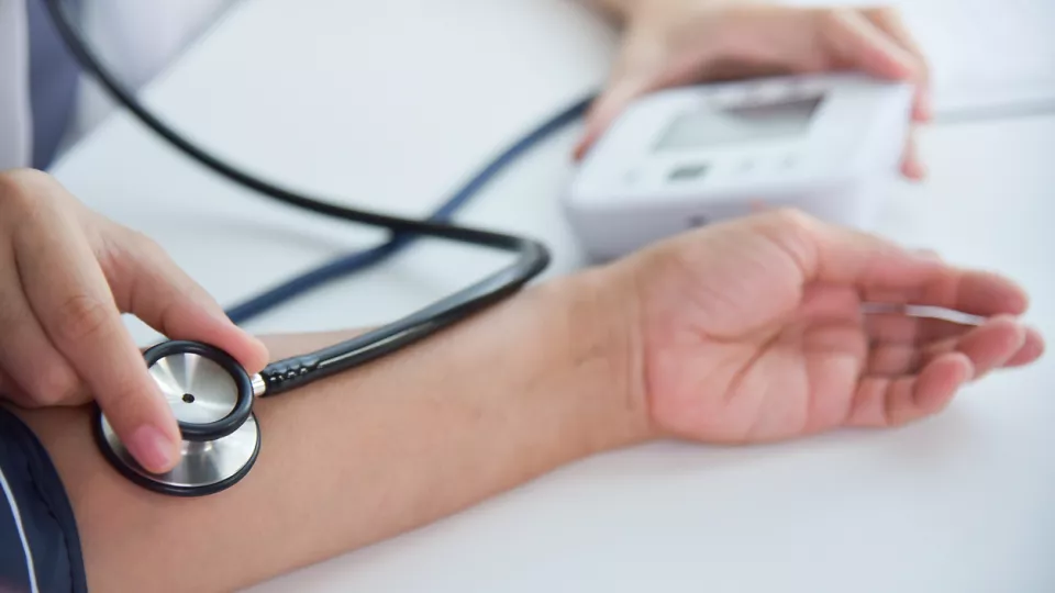 Detail image of blood pressure measurement of a patient. Photograph.