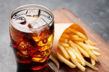 Photo of soft drink and french fries.